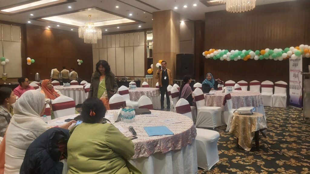 Members of the Aligarh Obstetrics & Gynaecological Society (AOGS) attending a scientific meeting in a conference hall, participating in continuing medical education, clinical discussions, and professional collaboration to advance women's healthcare.