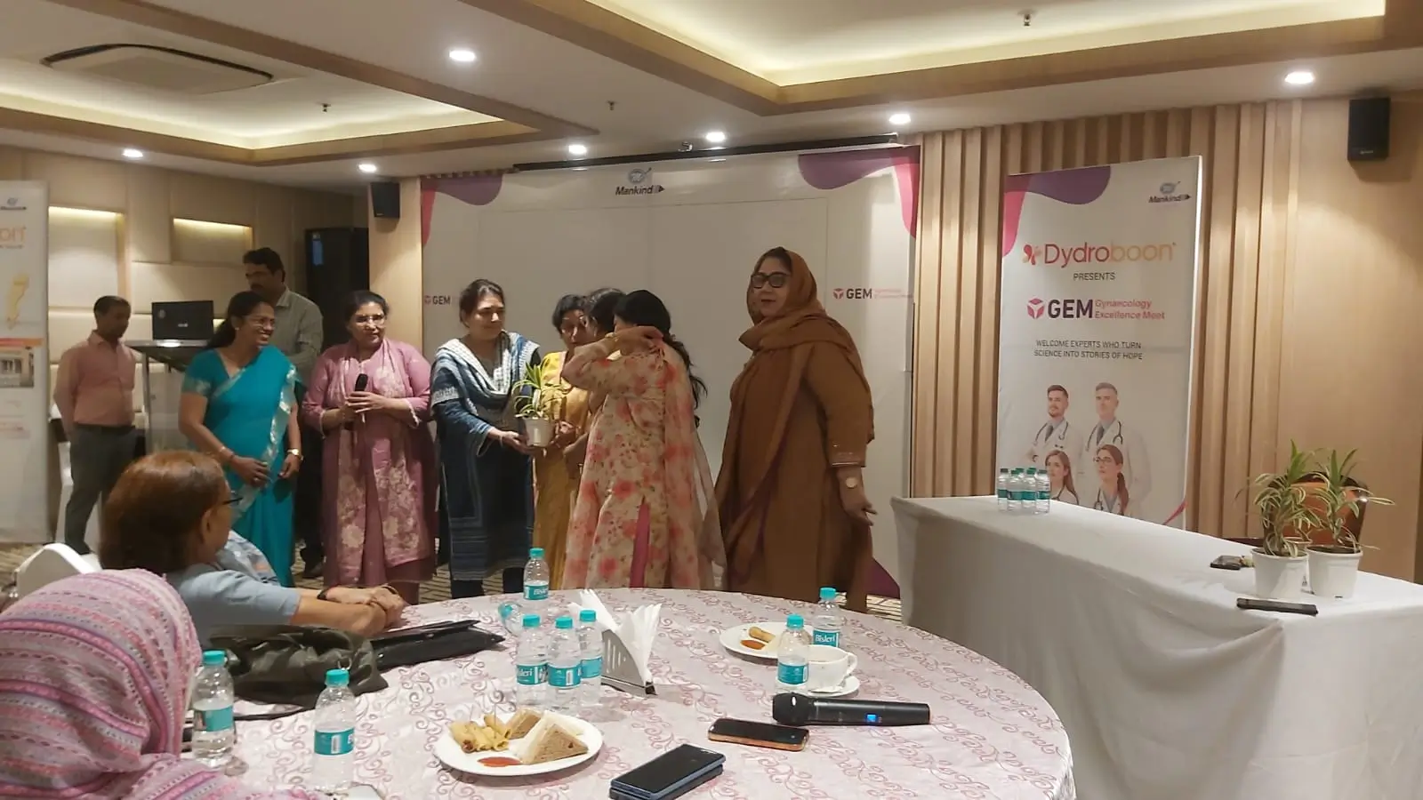 Healthcare professionals participating in a women's health awareness event with a recognition ceremony during a medical education program at Nishat Hospital.